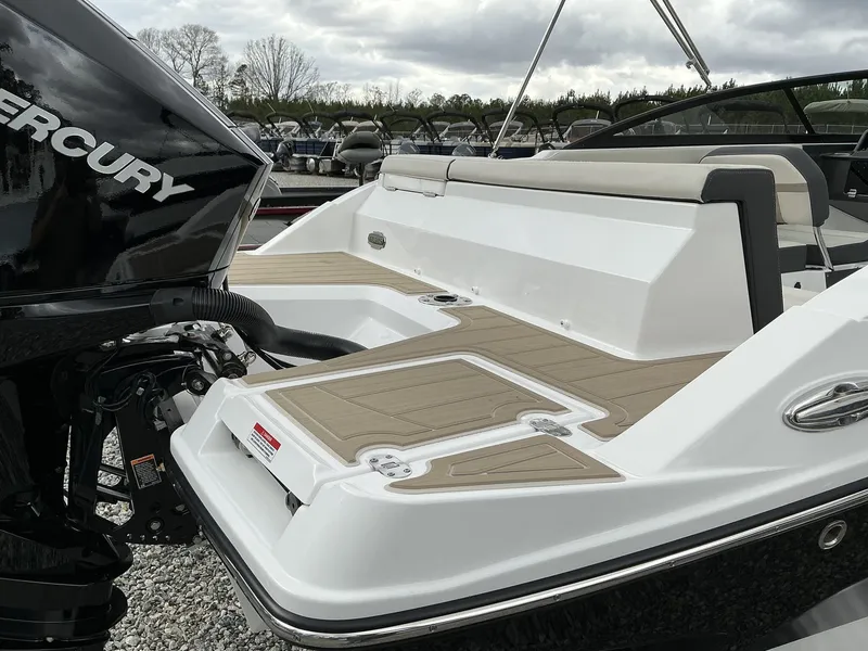 Slide: The Image of The image shows the stern of a 2025 Monterey M-205 boat with a Mercury outboard motor. - 5