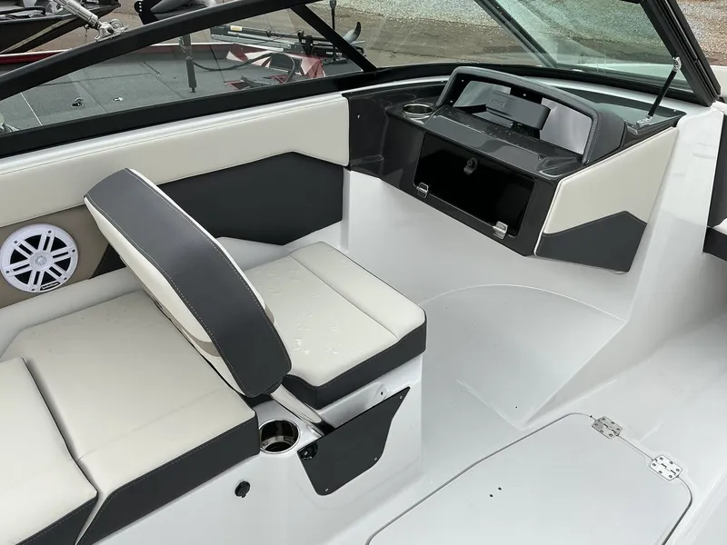 Slide: The Image of The image shows the cockpit of a 2025 Monterey M-205 boat with modern seating and helm console. - 13