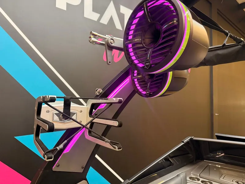 Slide: The Image of The image shows part of a 2021 Tigé 22RZX boat with illuminated speakers. - 14