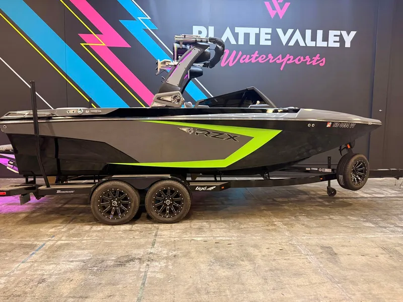 The Image of A 2021 Tigé 22RZX boat on a trailer in an indoor setting. - 1