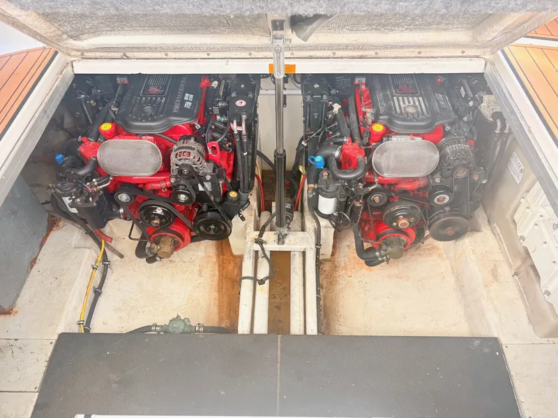 Slide: The Image of The engine compartment of a 2007 Chaparral Signature 350 features two red engines with black covers. - 26