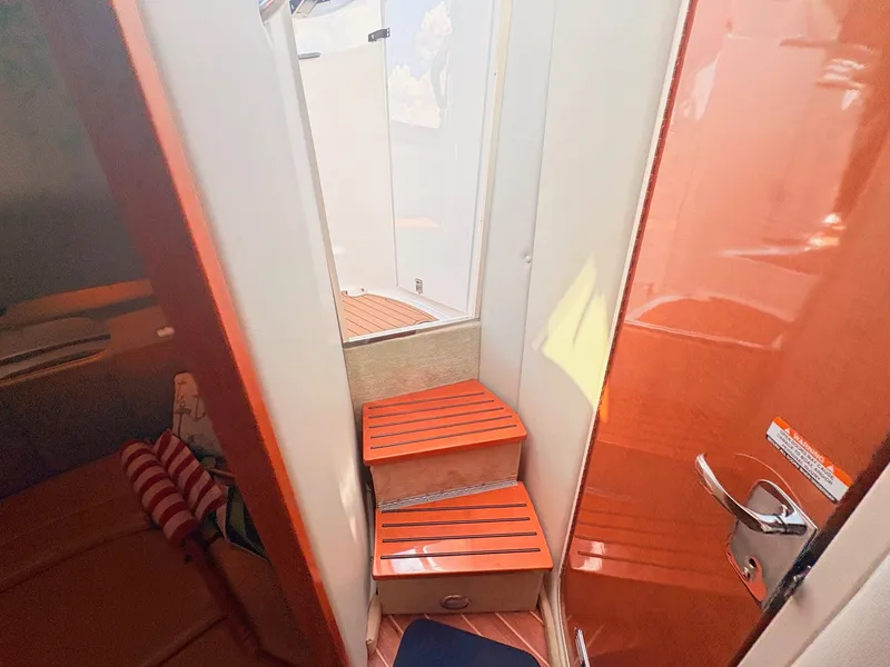 Slide: The Image of The cabin of the 2007 Chaparral Signature 350 features a staircase with wood accents. - 25