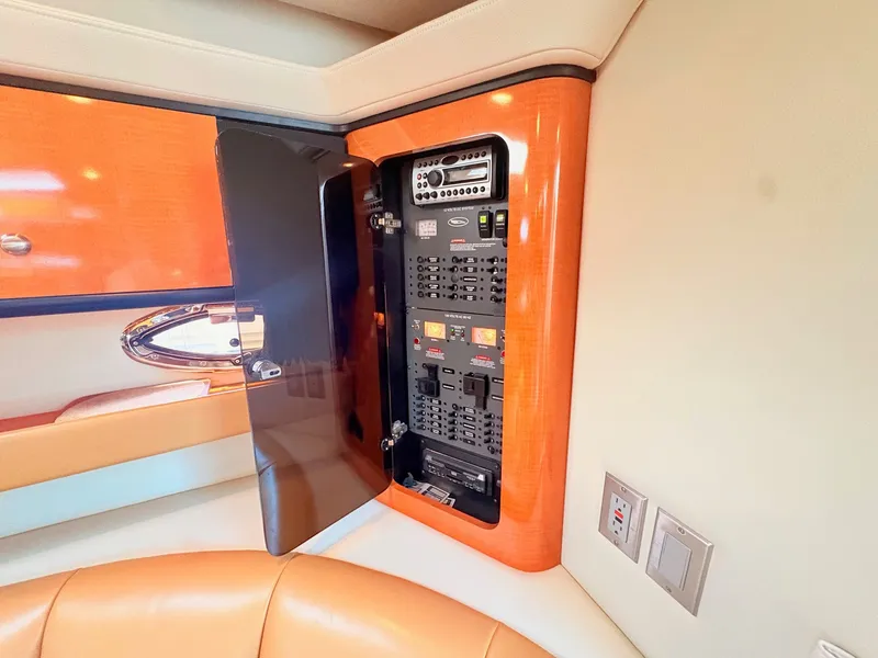 Slide: The Image of Electrical panel in a luxurious cabin with wood paneling and upholstered seating. - 19