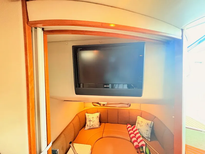 Slide: The Image of Interior of the 2007 Chaparral Signature 350 with cozy seating area and TV. - 21
