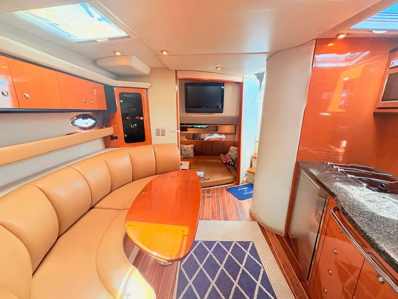 Slide: The Image of Interior of the 2007 Chaparral Signature 350 with elegant seating area and modern kitchen. - 16