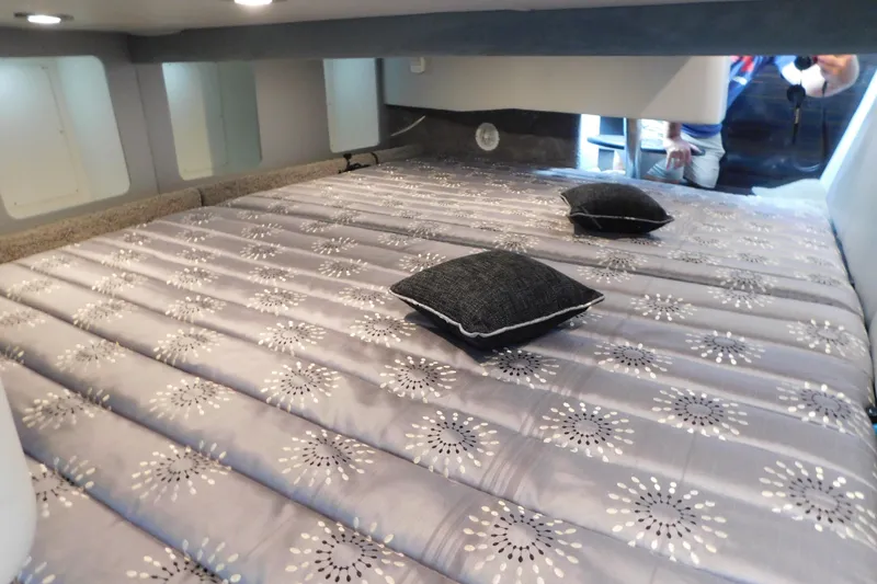 Slide: The Image of Cozy cabin interior of 2012 Formula 350 Sun Sport with patterned bedding and cushions. - 65