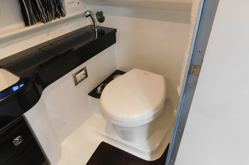 Slide: The Image of 2012 Formula 350 Sun Sport boat bathroom with toilet and sink. - 70