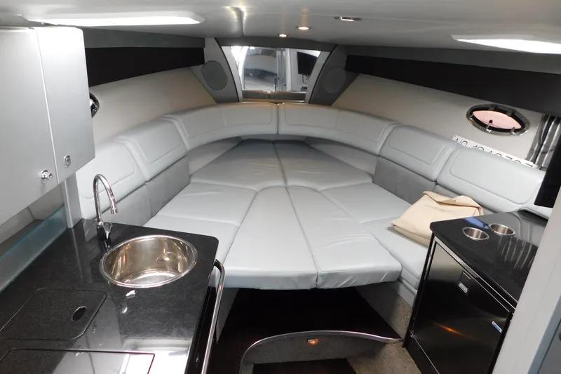 Slide: The Image of Luxurious interior of a 2012 Formula 350 Sun Sport boat with sleek seating and kitchenette. - 46