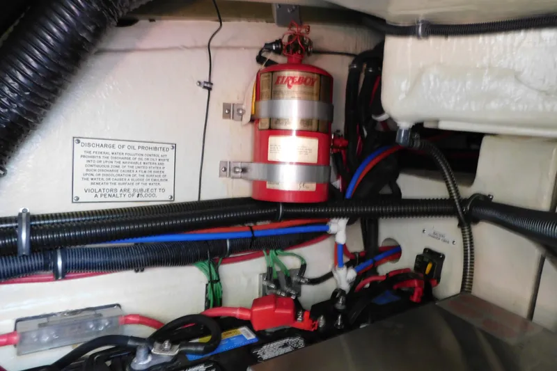 Slide: The Image of Engine compartment of a 2012 Formula 350 Sun Sport with fire extinguisher and wiring. - 89
