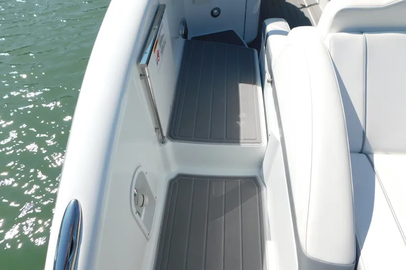 Slide: The Image of 2012 Formula 350 Sun Sport boat interior with white seating and gray flooring. - 13