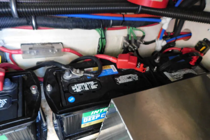 Slide: The Image of 2012 Formula 350 Sun Sport marine batteries with wiring and connections. - 81