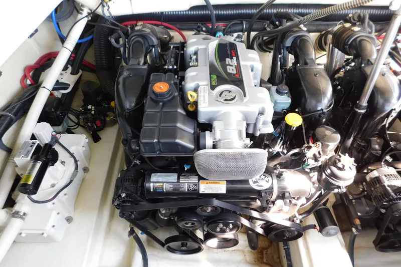 Slide: The Image of Engine compartment of a 2012 Formula 350 Sun Sport boat, showcasing detailed components. - 79