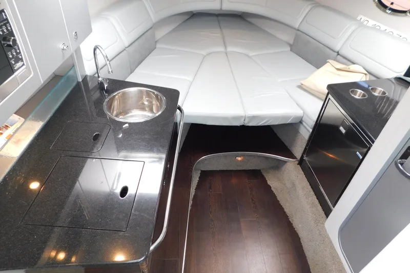 Slide: The Image of Interior of 2012 Formula 350 Sun Sport boat with sleek kitchenette and cozy seating area. - 45