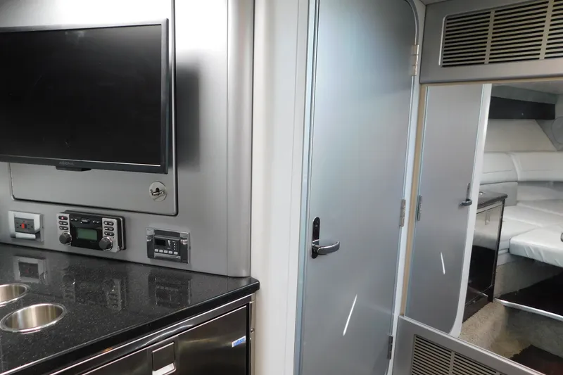 Slide: The Image of Interior of 2012 Formula 350 Sun Sport yacht with TV, control panel, and cabin view. - 68