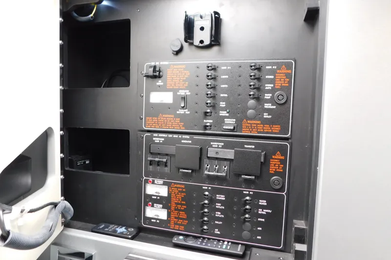 Slide: The Image of Control panel of a 2012 Formula 350 Sun Sport boat, featuring switches and circuit breakers. - 50
