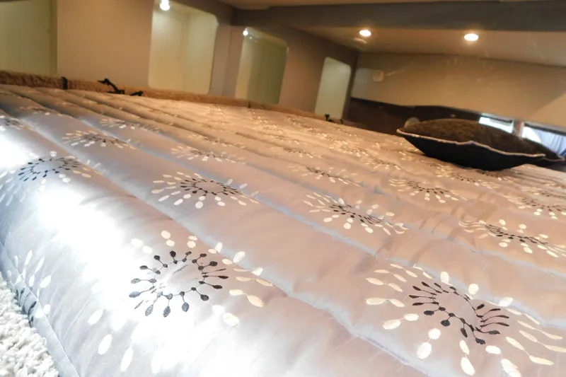Slide: The Image of Interior cabin of 2012 Formula 350 Sun Sport with patterned bedding and ambient lighting. - 64