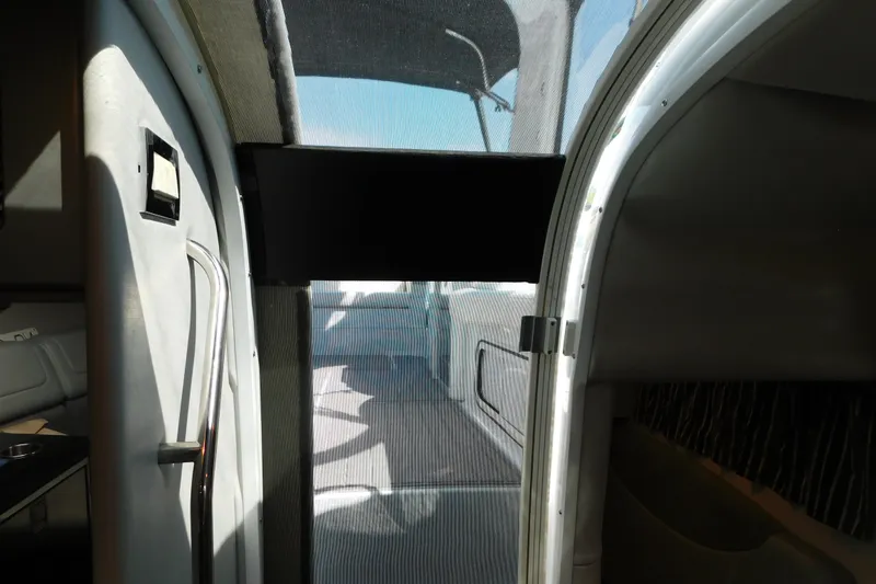 Slide: The Image of Interior view of 2012 Formula 350 Sun Sport boat, showing cabin entrance and seating area. - 66