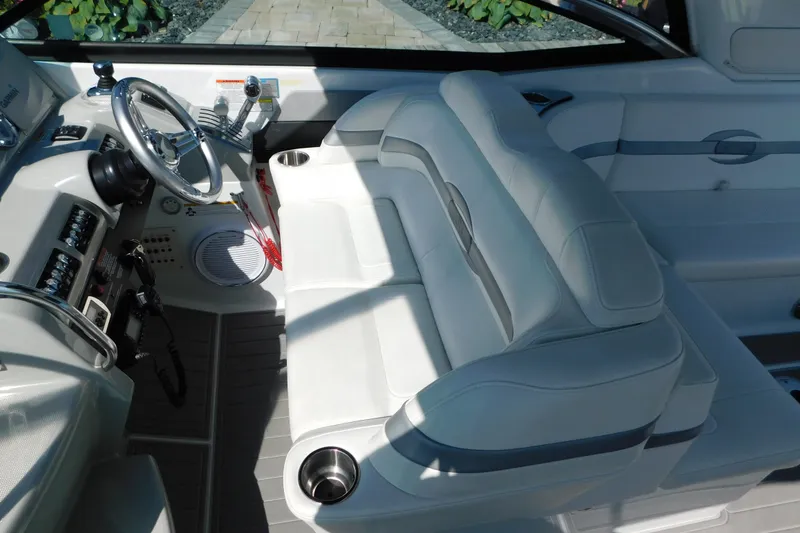 Slide: The Image of Interior of a 2012 Formula 350 Sun Sport boat with sleek white seating and controls. - 31