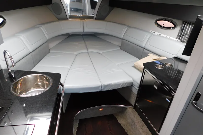 Slide: The Image of Luxurious interior of a 2012 Formula 350 Sun Sport boat with plush seating and kitchenette. - 75