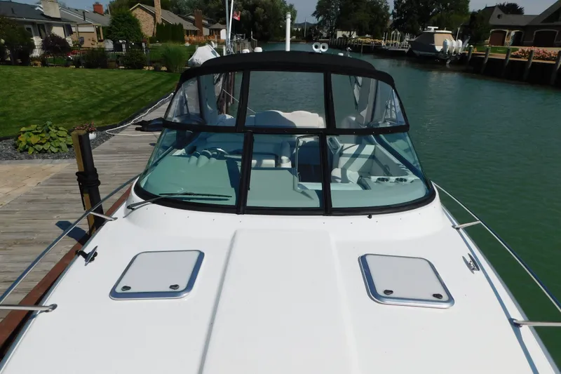 Slide: The Image of 2012 Formula 350 Sun Sport boat docked by a scenic waterfront. - 98