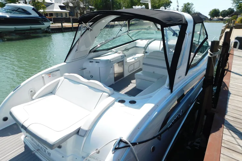 Slide: The Image of 2012 Formula 350 Sun Sport boat docked, featuring sleek design and spacious seating. - 94