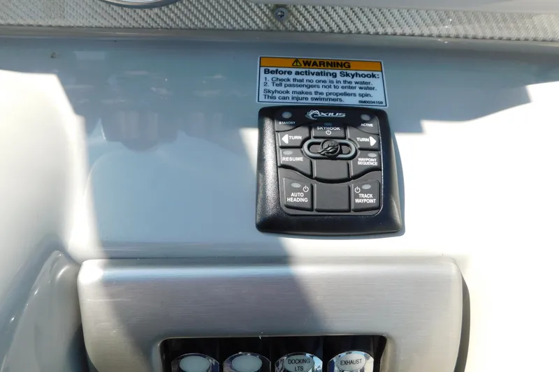 Slide: The Image of Control panel of a 2012 Formula 350 Sun Sport boat with Skyhook warning label. - 34
