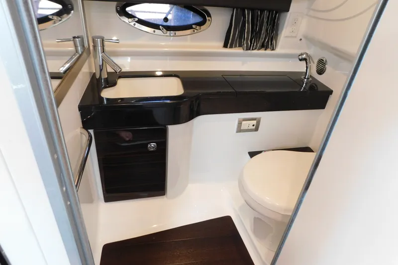 Slide: The Image of 2012 Formula 350 Sun Sport bathroom with sleek black countertop and modern fixtures. - 69