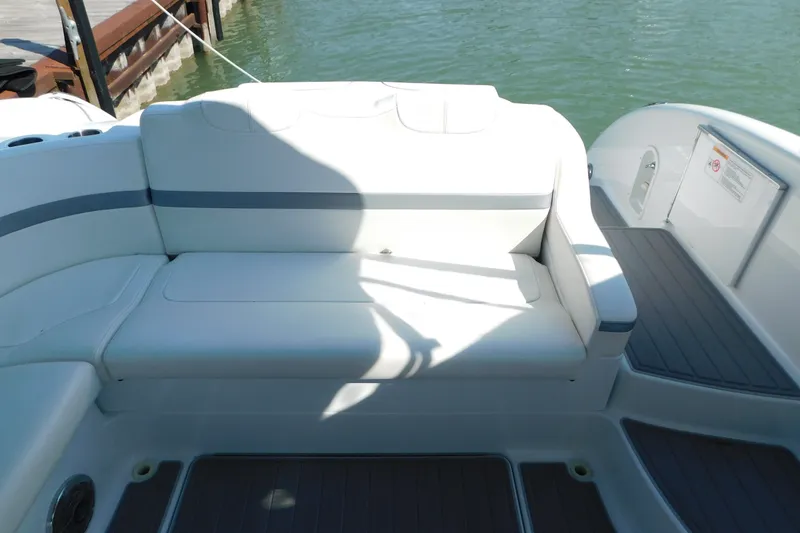 Slide: The Image of 2012 Formula 350 Sun Sport boat interior with white seating and gray accents. - 16
