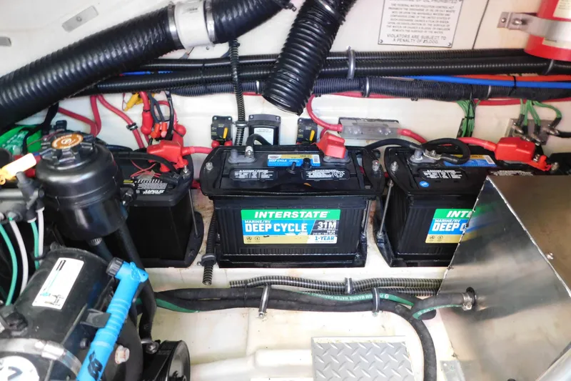 Slide: The Image of 2012 Formula 350 Sun Sport boat engine compartment with Interstate deep cycle batteries. - 84