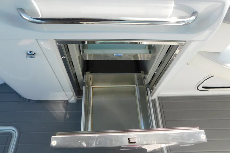 Slide: The Image of Open storage compartment on a 2012 Formula 350 Sun Sport boat. - 26