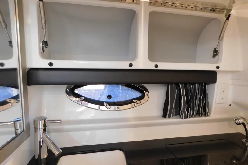 Slide: The Image of Interior of 2012 Formula 350 Sun Sport boat with porthole and sink. - 73