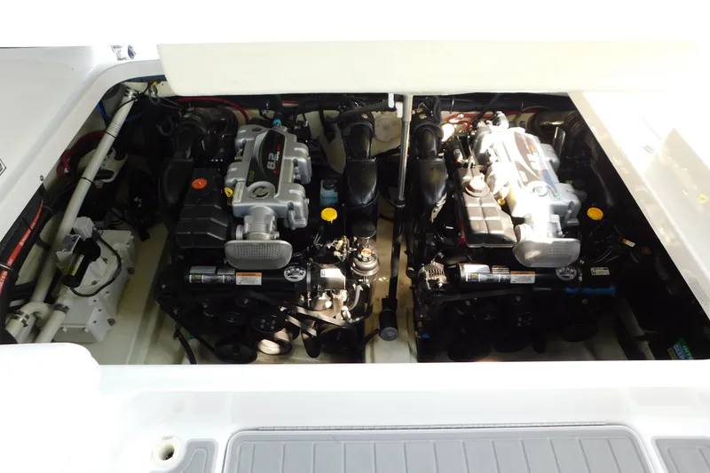 Slide: The Image of Engine compartment of a 2012 Formula 350 Sun Sport boat, featuring dual powerful engines. - 77