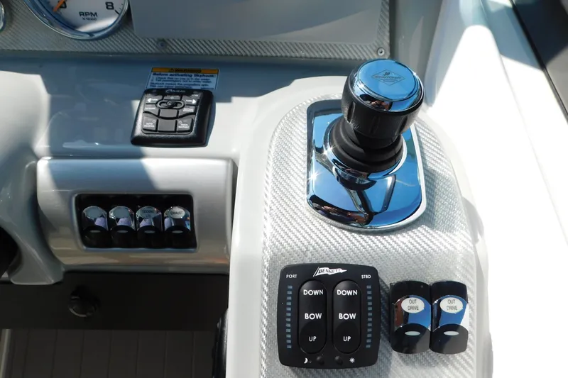 Slide: The Image of Control panel of a 2012 Formula 350 Sun Sport boat with joystick and switches. - 33