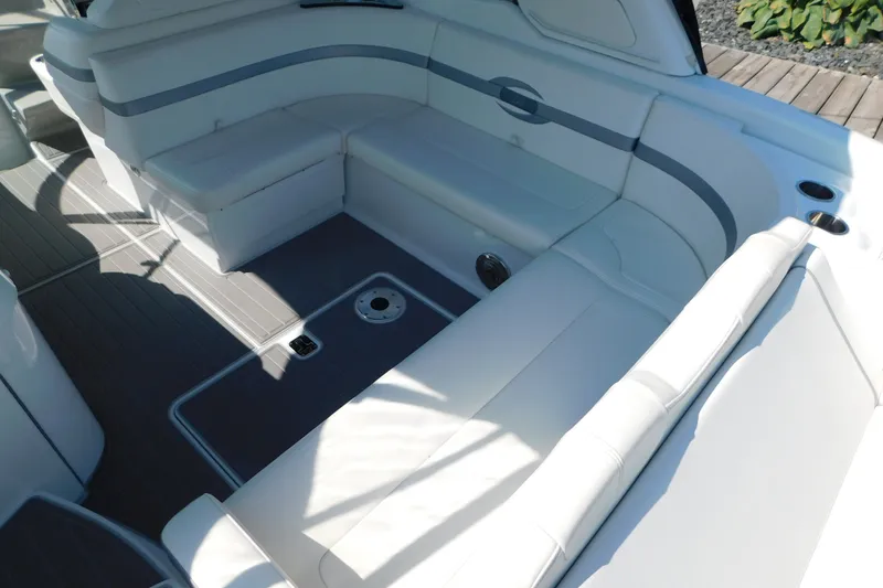 Slide: The Image of 2012 Formula 350 Sun Sport boat interior with white seating and sleek design. - 14