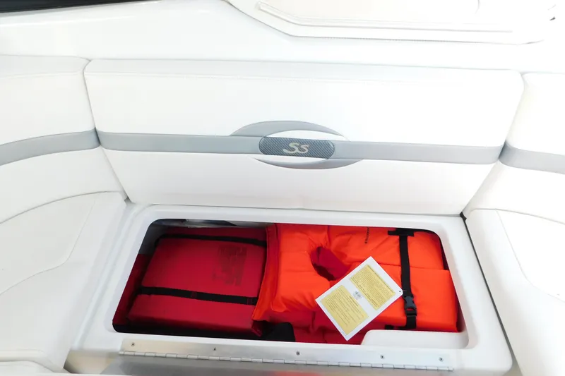 Slide: The Image of Storage compartment in a 2012 Formula 350 Sun Sport boat with life jackets. - 19