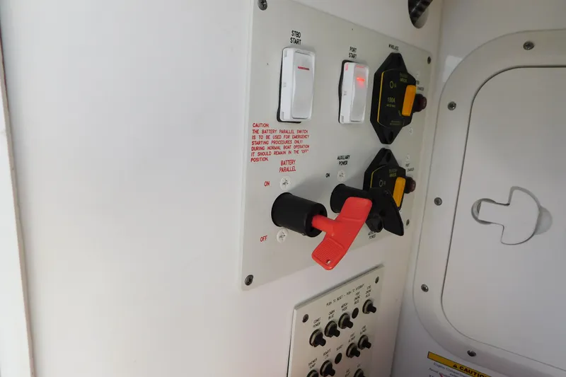 Slide: The Image of Control panel of a 2012 Formula 350 Sun Sport boat with switches and safety instructions. - 24