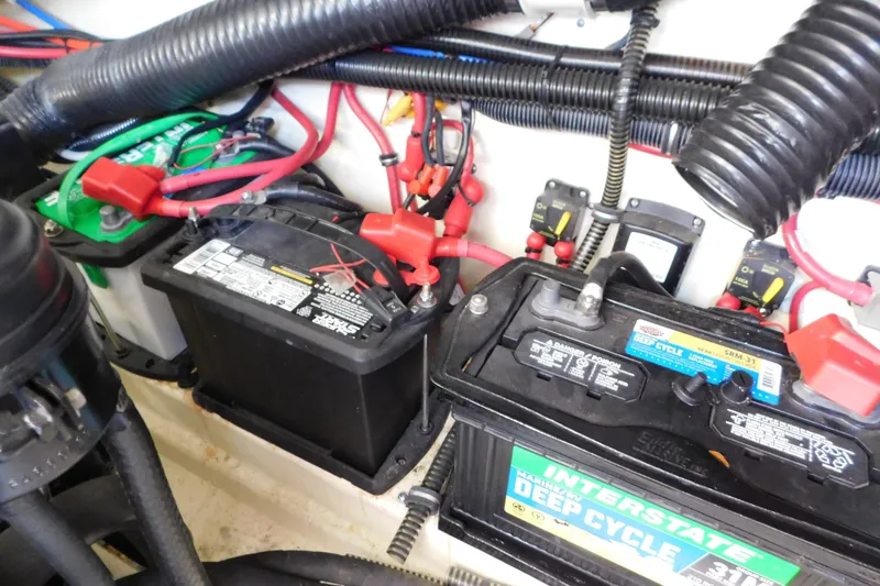 Slide: The Image of Battery compartment of a 2012 Formula 350 Sun Sport boat with wiring and deep cycle batteries. - 83