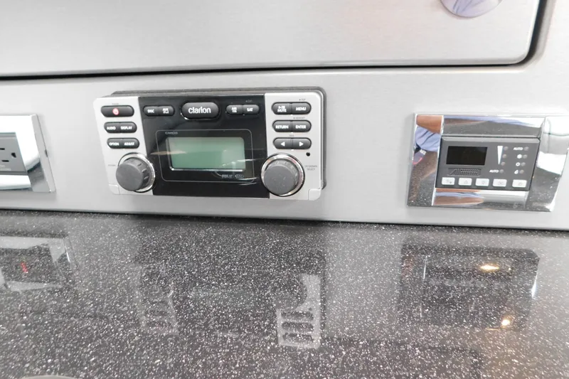 Slide: The Image of Control panel of a 2012 Formula 350 Sun Sport boat with Clarion audio system. - 53