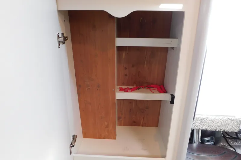 Slide: The Image of Empty wooden cabinet inside 2012 Formula 350 Sun Sport boat. - 67