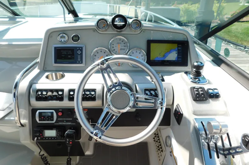 Slide: The Image of Cockpit of 2012 Formula 350 Sun Sport with steering wheel, gauges, and navigation system. - 39