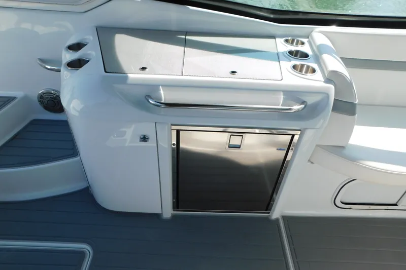 Slide: The Image of 2012 Formula 350 Sun Sport boat interior with sleek kitchenette and stainless steel fridge. - 22