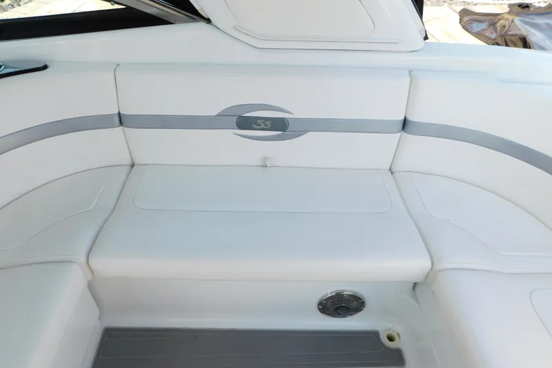 Slide: The Image of 2012 Formula 350 Sun Sport boat interior with white cushioned seating and sleek design. - 18