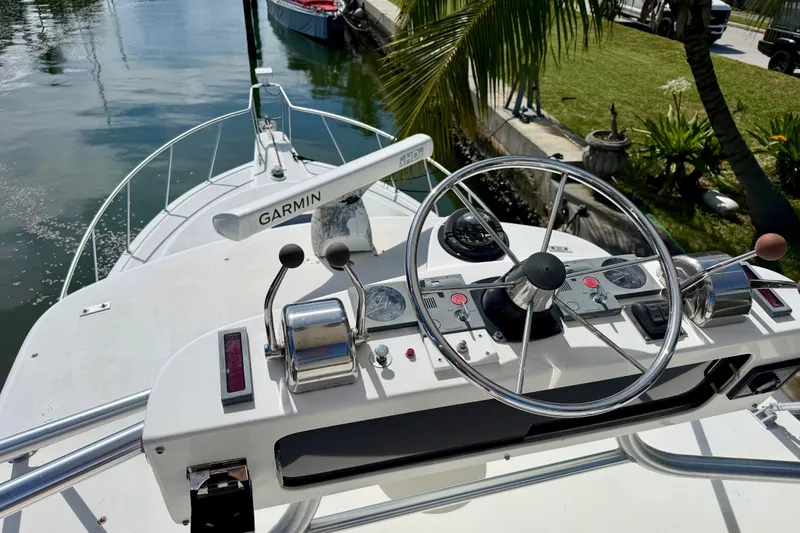 Slide: The Image of Helm of 2001 Henriques 35 Express boat with Garmin navigation system. - 17