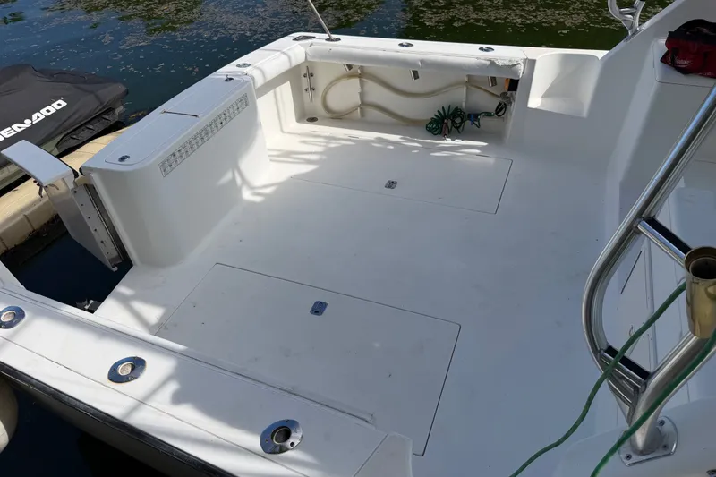 Slide: The Image of 2001 Henriques 35 Express boat deck with clean, spacious layout and dockside view. - 19