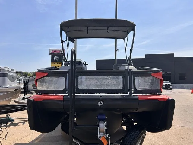 Slide: The Image of A 2022 Sea-Doo Switch Sport 18 on a trailer in an outdoor setting. - 8