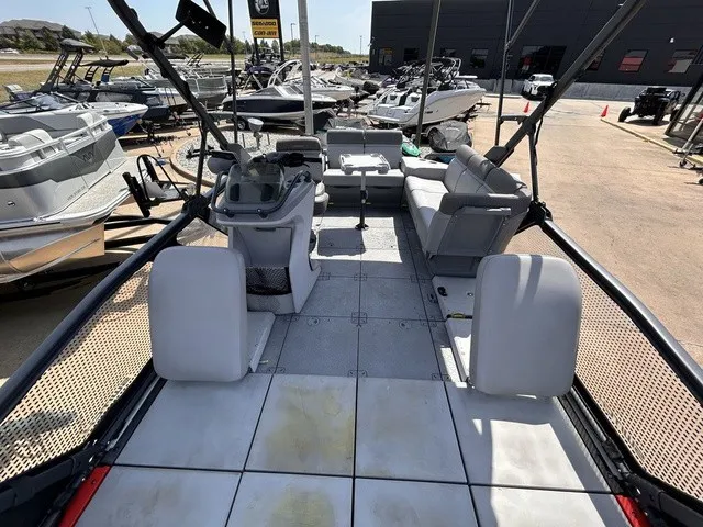 Slide: The Image of The image shows the deck of a 2022 Sea-Doo Switch Sport 18 with seating and a helm console. - 10