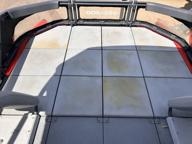 Slide: The Image of The image shows the spacious deck of a 2022 Sea-Doo Switch Sport 18. - 19