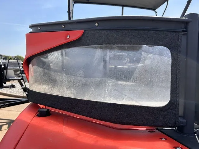 Slide: The Image of Close-up of a red 2022 Sea-Doo Switch Sport 18 with a clear plastic window. - 9