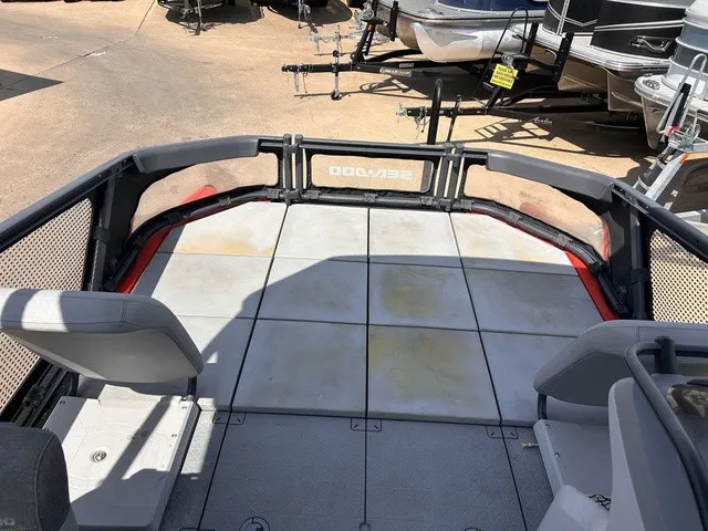 Slide: The Image of The image shows the deck of a 2022 Sea-Doo Switch Sport 18 with gray seating. - 18