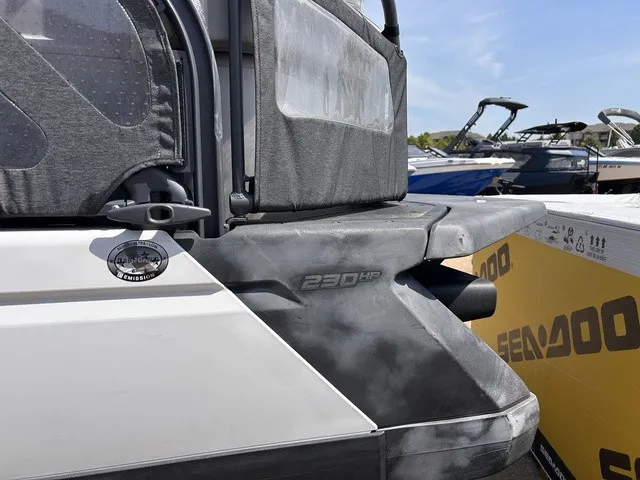 Slide: The Image of 2022 Sea-Doo Switch Sport 18 with 230 HP, parked at a marina. - 4